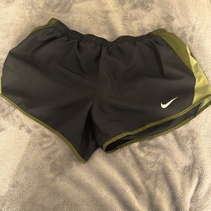 Green and black Nike shorts